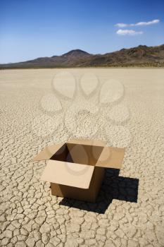 Royalty Free Photo of an Empty Opened Box in a Desert Landscape in California