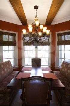 Dining room with table and chairs in affluent home.