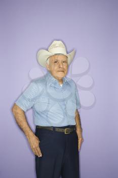Royalty Free Photo of an Older Man Wearing a Cowboy Hat