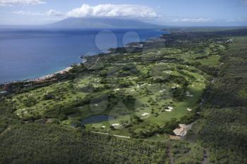 Royalty Free Photo of an Aerial of a Golf Course on Maui, Hawaii Coastline With Pacific Ocean