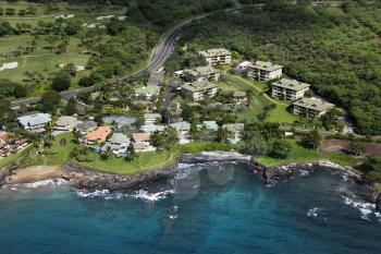 Royalty Free Photo of an Aerial of Houses Clustered by Maui, Hawaii Coast