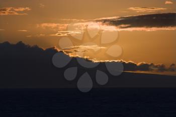 Sunset over Pacific Ocean with clouds in Maui, Hawaii, USA.