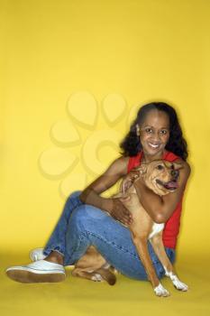 Royalty Free Photo of a Woman Hugging a Dog