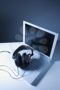 Royalty Free Photo of Headphones Placed on a Laptop Computer