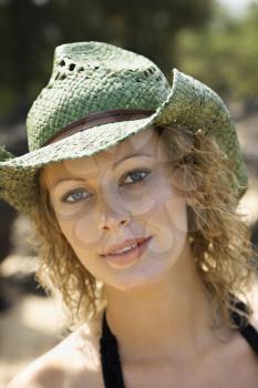 Royalty Free Photo of a Portrait of a Young Female Wearing a Hat