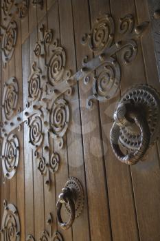 Royalty Free Photo of a Close-up of Wooden Doors With Decorative Metalwork in Lisbon, Portugal