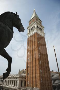Royalty Free Photo of a Horse Statue and Campanile in Piazza San Marco in Venice, Italy