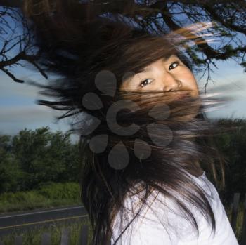 Royalty Free Photo of a Woman Swinging Her Hair