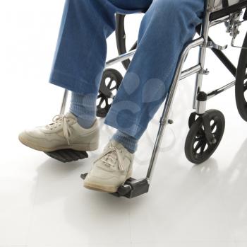 Royalty Free Photo of Legs and Feet of an Elderly Man Sitting in a Wheelchair