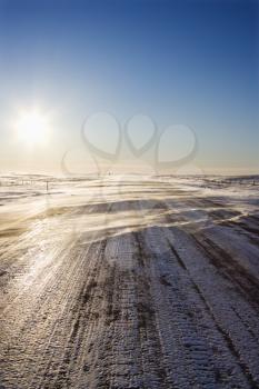 Royalty Free Photo of an Ice Covered Road with Tire Marks