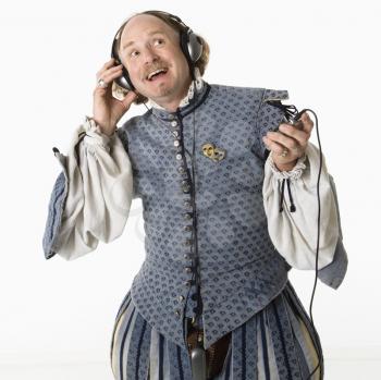 Royalty Free Photo of William Shakespeare Listening to an MP3 Player
