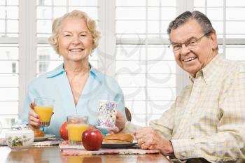 Royalty Free Photo of an Older Couple Having Breakfast Together