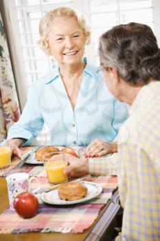 Royalty Free Photo of an Older Couple Having Breakfast Together