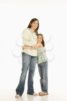 Royalty Free Photo of a Portrait of a Mother and Daughter Standing Hugging