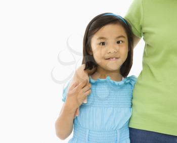 Royalty Free Photo of a Mother and Daughter Standing With Arms Around Each Other