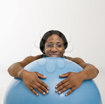 Royalty Free Photo of a Woman Resting on an Exercise Ball