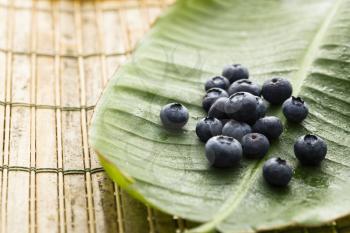 Royalty Free Photo of Blueberries on a Banana Leaf