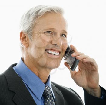 Royalty Free Photo of a Man Smiling and Talking on a Cellphone