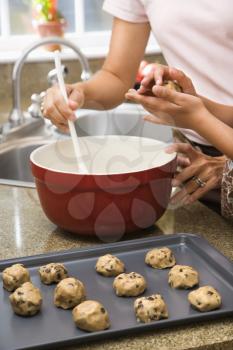Royalty Free Photo of a Mother and Daughter Baking Cookies