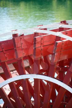 Royalty Free Photo of a Close-up of a Red Paddle Wheel of a Riverboat in Sacramento, California, USA