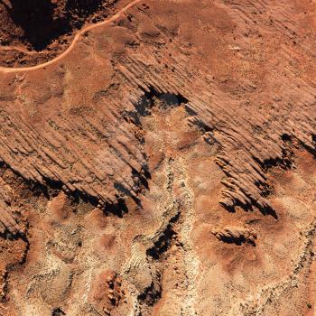 Bird's eye view of rock formations in a desert environment. Square format.