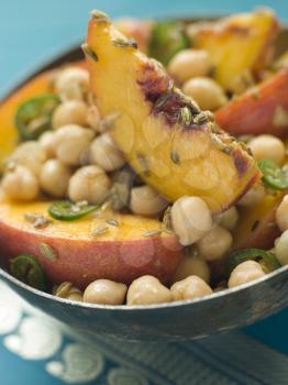 Royalty Free Photo of a Bowl of Chick Pea and Peach Salad
