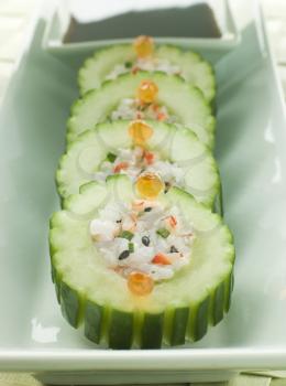 Royalty Free Photo of a Cucumber Sushi Roll With Crayfish and a Soy Dip