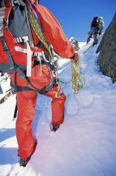 Royalty Free Photo of Two People Climbing a Mountain