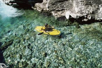 Royalty Free Photo of a Kayaker in Calm Water