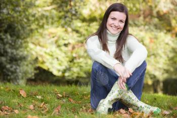 Royalty Free Photo of a Woman Sitting on the Grass