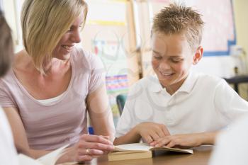 Royalty Free Photo of a Teacher and Student Reading