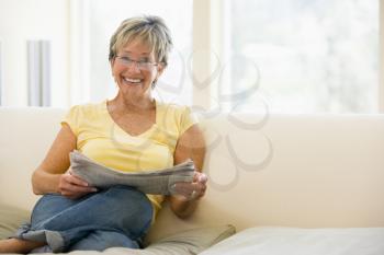 Royalty Free Photo of a Woman Reading a Newspaper