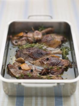 Royalty Free Photo of a Tray of Confit Duck Legs