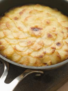Royalty Free Photo of Pomme Anna Cake in a Frying Pan