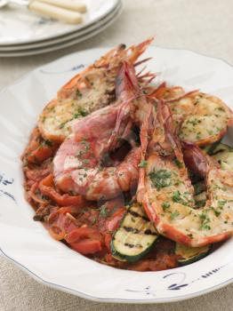 Royalty Free Photo of Grilled Tiger Prawns on Piperade with Grilled Courgettes