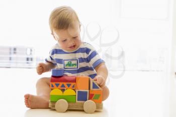 Royalty Free Photo of a Baby With a Truck