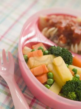 Royalty Free Photo of Pasta Spirals and Tomato Sauce With Mixed Vegetables