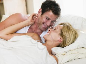 Royalty Free Photo of a Couple Lying in Bed