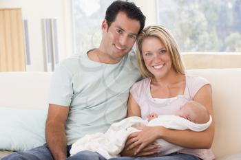 Royalty Free Photo of a Couple With Their Baby