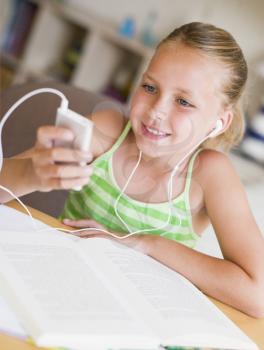 Royalty Free Photo of a Young Girl With an MP3 Player