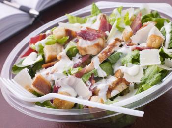 Royalty Free Photo of a Chicken and Bacon Caesar Salad
