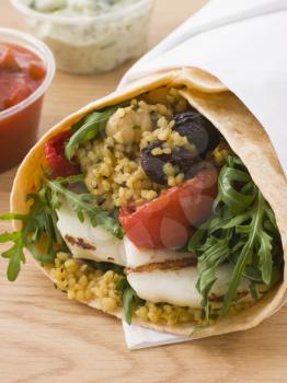 Royalty Free Photo of Spiced Couscous And Grilled Halloumi Tortilla Wrap