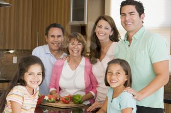 Royalty Free Photo of a Family Preparing a Meal