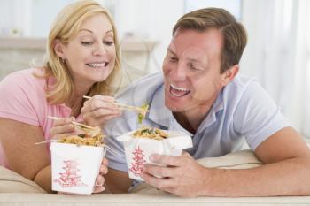 Royalty Free Photo of a Couple Eating Chinese Takeout