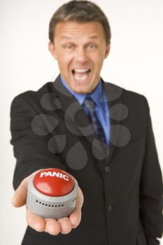 Royalty Free Photo of a Man Holding a Panic Button