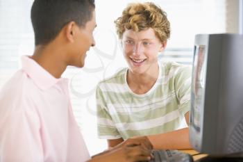 Royalty Free Photo of Two Boys Using a Computer