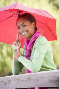 Royalty Free Photo of a Girl With an Umbrella