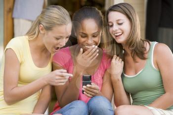 Royalty Free Photo of Girls With a Cellphone
