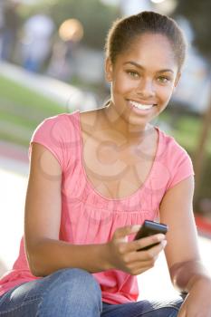 Royalty Free Photo of a Girl With a Cellphone