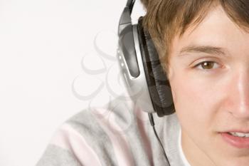 Royalty Free Photo of a Boy Listening to Headphones